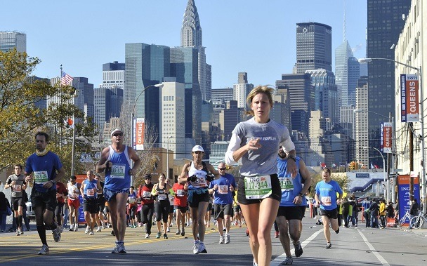Runners make their way down 44th Drive in the Queens borough of New York during the New York City Marathon on Sunday, Nov. 6, 2011, in New York. (AP Photo/Kathy Kmonicek)