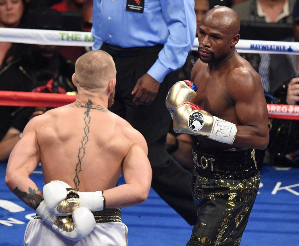 Conor McGregor taunts Floyd Mayweather Jnr during their fight at the T-Mobile Arena, Las Vegas. PRESS ASSOCIATION Photo. Picture date: Saturday August 26, 2017. See PA story BOXING Las Vegas. Photo credit should read: PA Wire/PA Wire. RESTRICTIONS: Editorial use only. No commercial use.