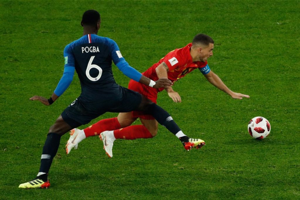 France's midfielder Paul Pogba (L) vies for the ball with Belgium's forward Eden Hazard during the Russia 2018 World Cup semi-final football match between France and Belgium at the Saint Petersburg Stadium in Saint Petersburg on July 10, 2018. / AFP PHOTO / Adrian DENNIS / RESTRICTED TO EDITORIAL USE - NO MOBILE PUSH ALERTS/DOWNLOADS