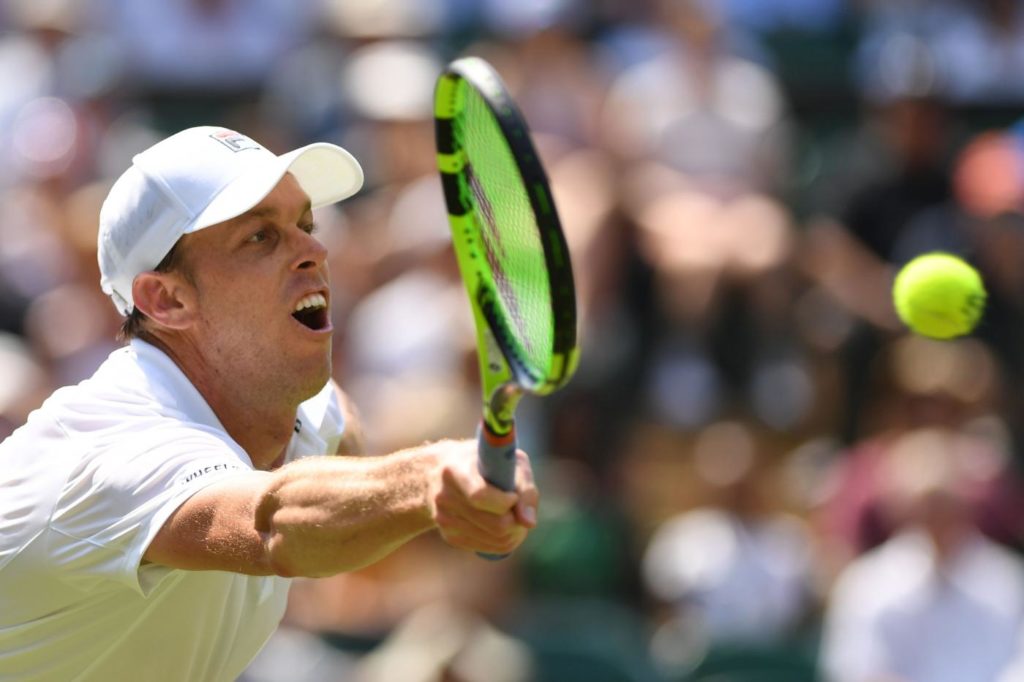 US player Sam Querrey returns to France's Gael Monfils in their men's singles third round match on the fifth day of the 2018 Wimbledon Championships at The All England Lawn Tennis Club in Wimbledon, southwest London, on July 6, 2018. / AFP PHOTO / Glyn KIRK / RESTRICTED TO EDITORIAL USE